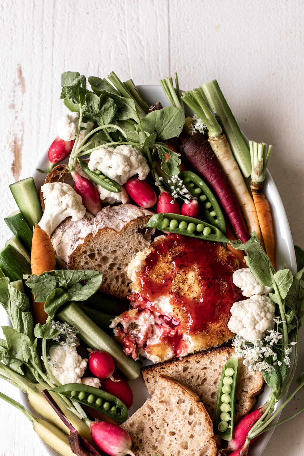 In one of my favorite goat cheese recipes the cheese is shaped and coated in breadcrumbs and fried topped with raspberry hot honey