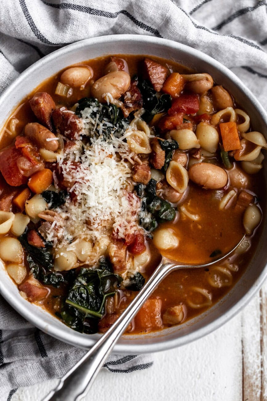 How to Make Pasta e Fagioli topped with parmesan cheese.