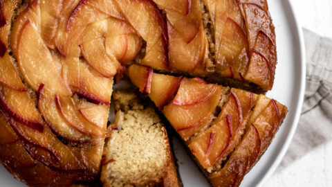 caramelized peach slices on a southern cornbread cake