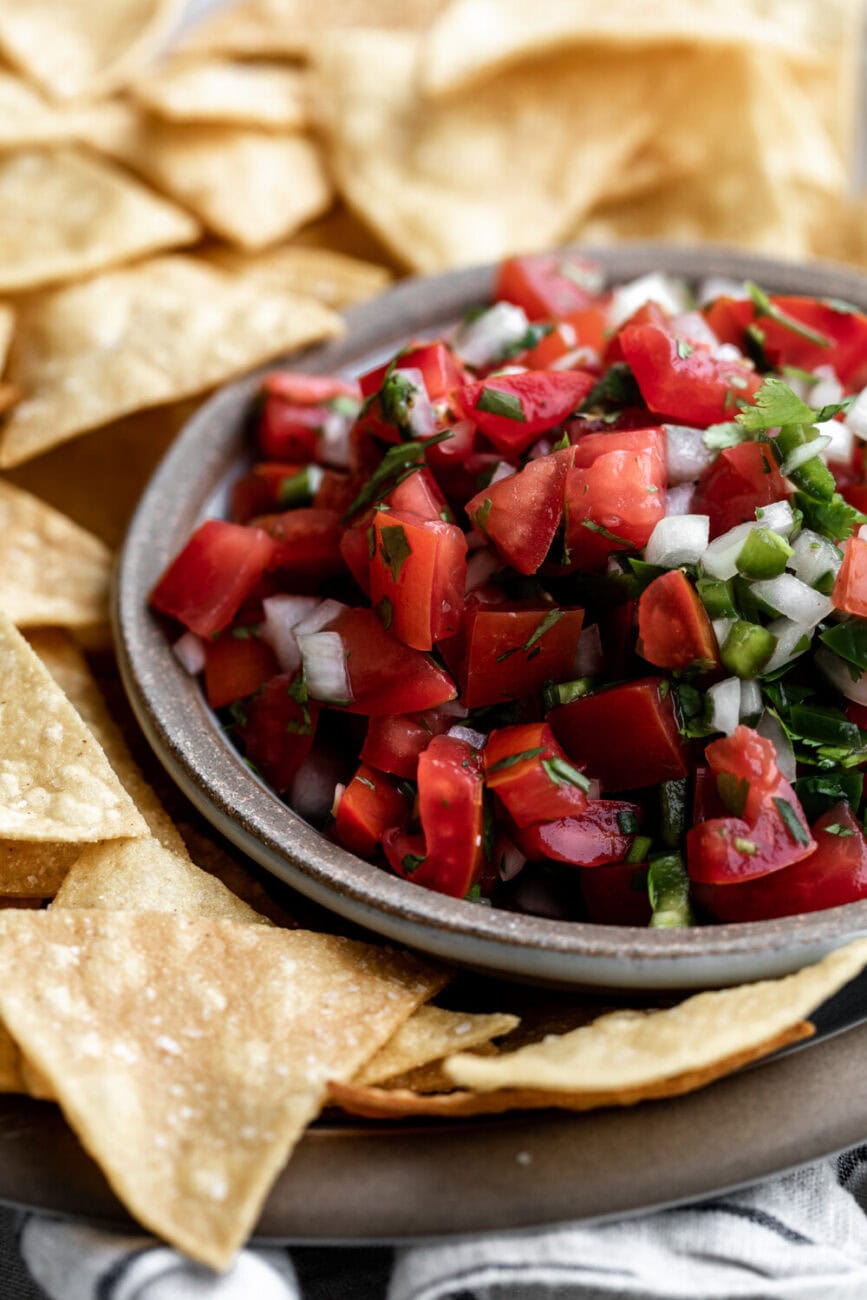 Pico de gallo recipe in serving bowl with tomato onion jalapeño.