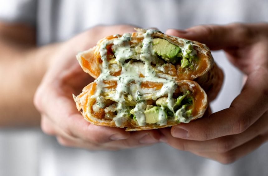 Vegetarian Breakfast Burrito with Fire-Roasted Salsa and Cilantro Crema recipe, cut in half. 