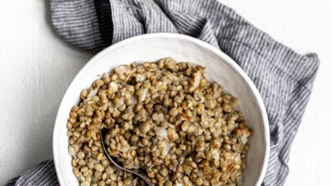 refried lentils in white serving bowl.