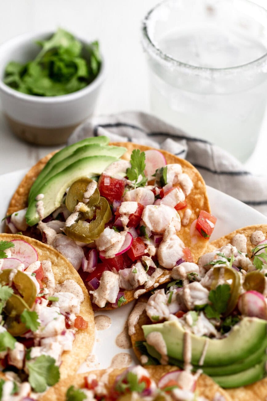 white fish ceviche tostada with jalapeño and avocado.