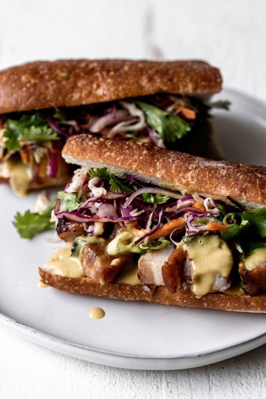 Roast Pork Belly Sandwich with Yellow Coconut Curry Sauce & Thai Slaw.