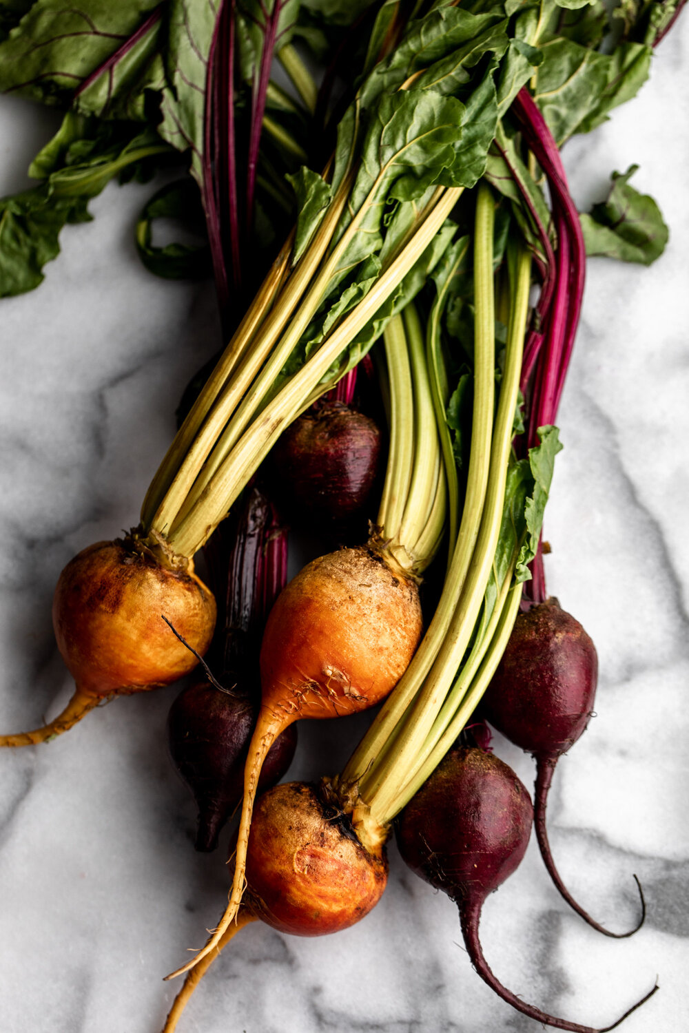 red beets and golden beets with stems