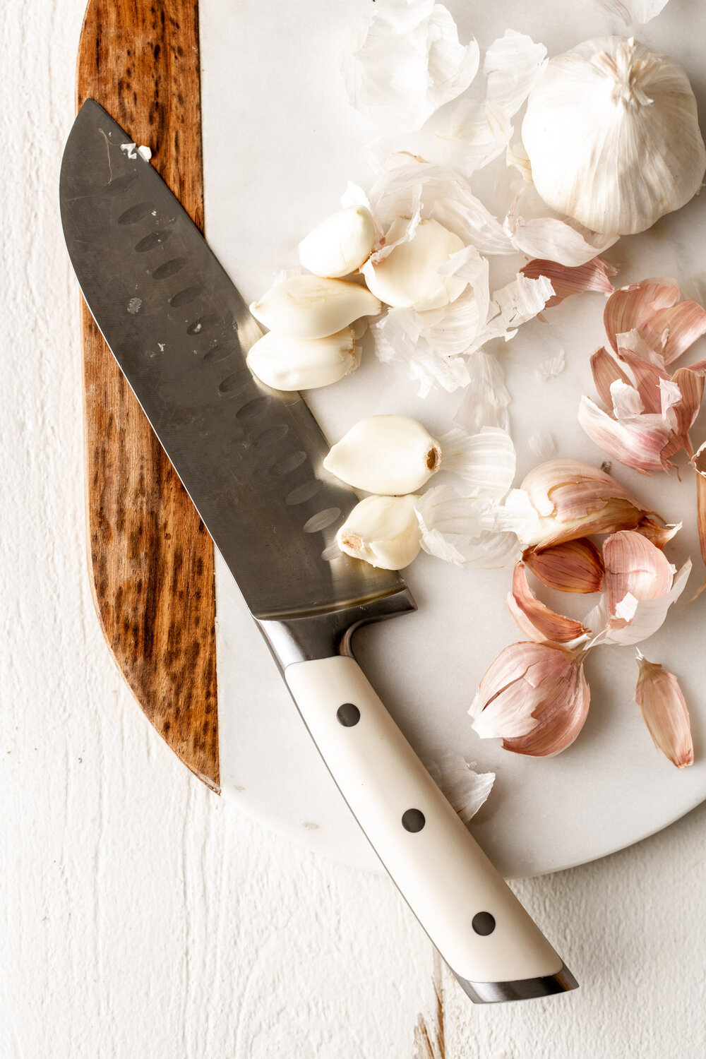 garlic cloves with knife