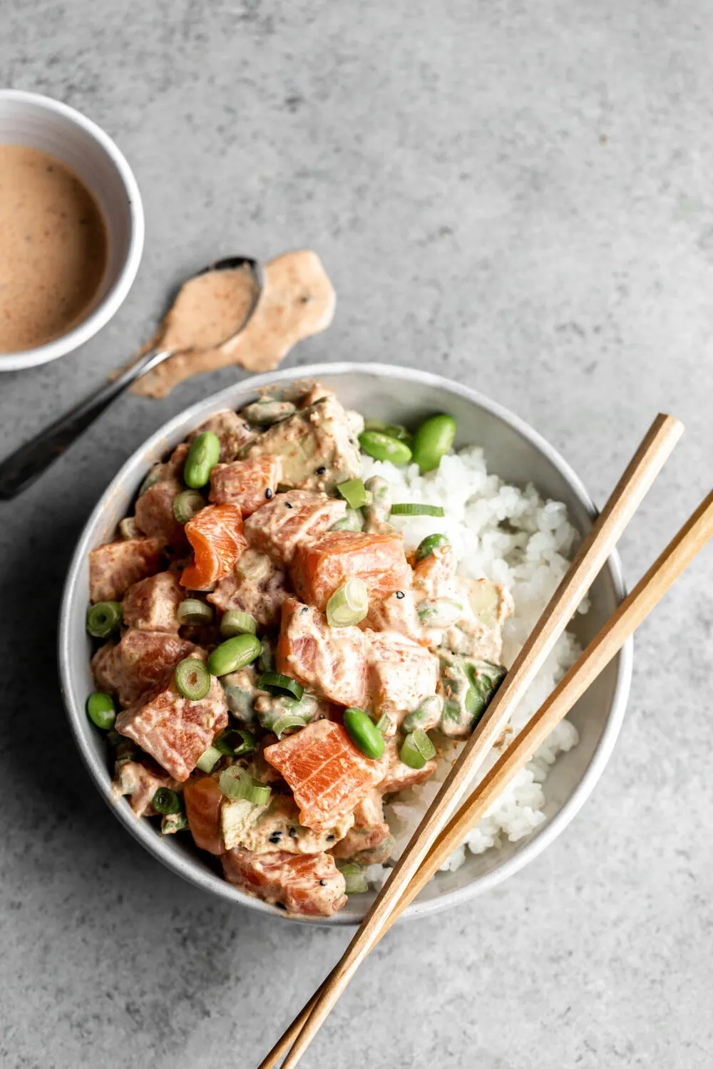Salmon Poké with Creamy Togarashi Sauce with edamame and green onion