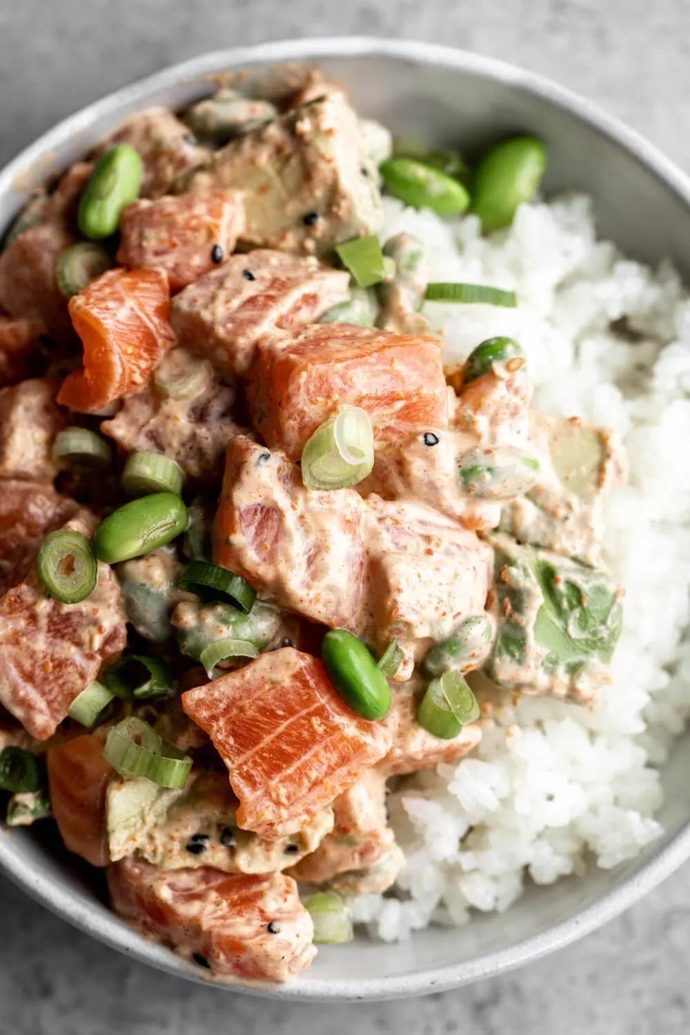 Salmon and Ahi Poke with avocado green onion and edamame