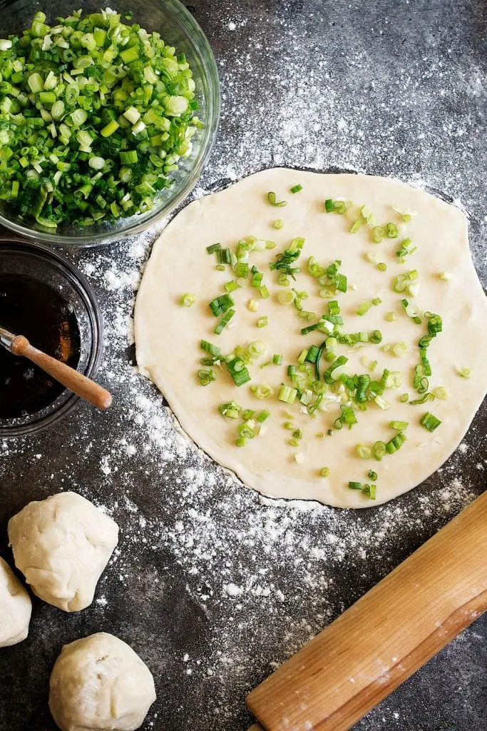 how to make scallion pancakes rolled out dough with diced scallions