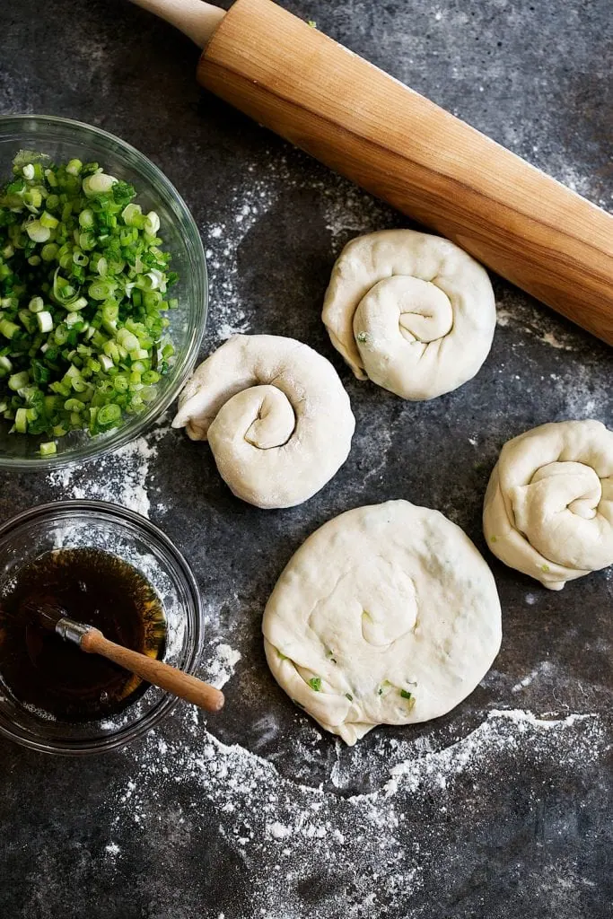 coiled scallion pancake dough to rest