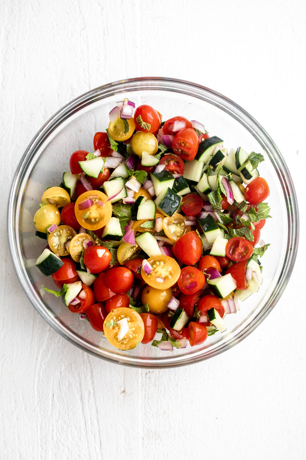 greek pico de gallo with cucumber tomato onion and herbs