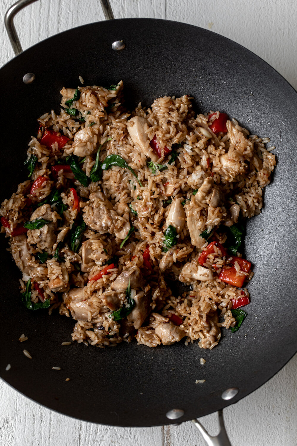 Spicy Basil Fried Rice with Chicken in wok