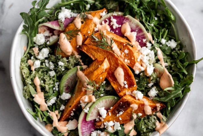 Spicy Green Herbed Crispy Rice Sweet Potato Bowl with Spicy Yogurt.