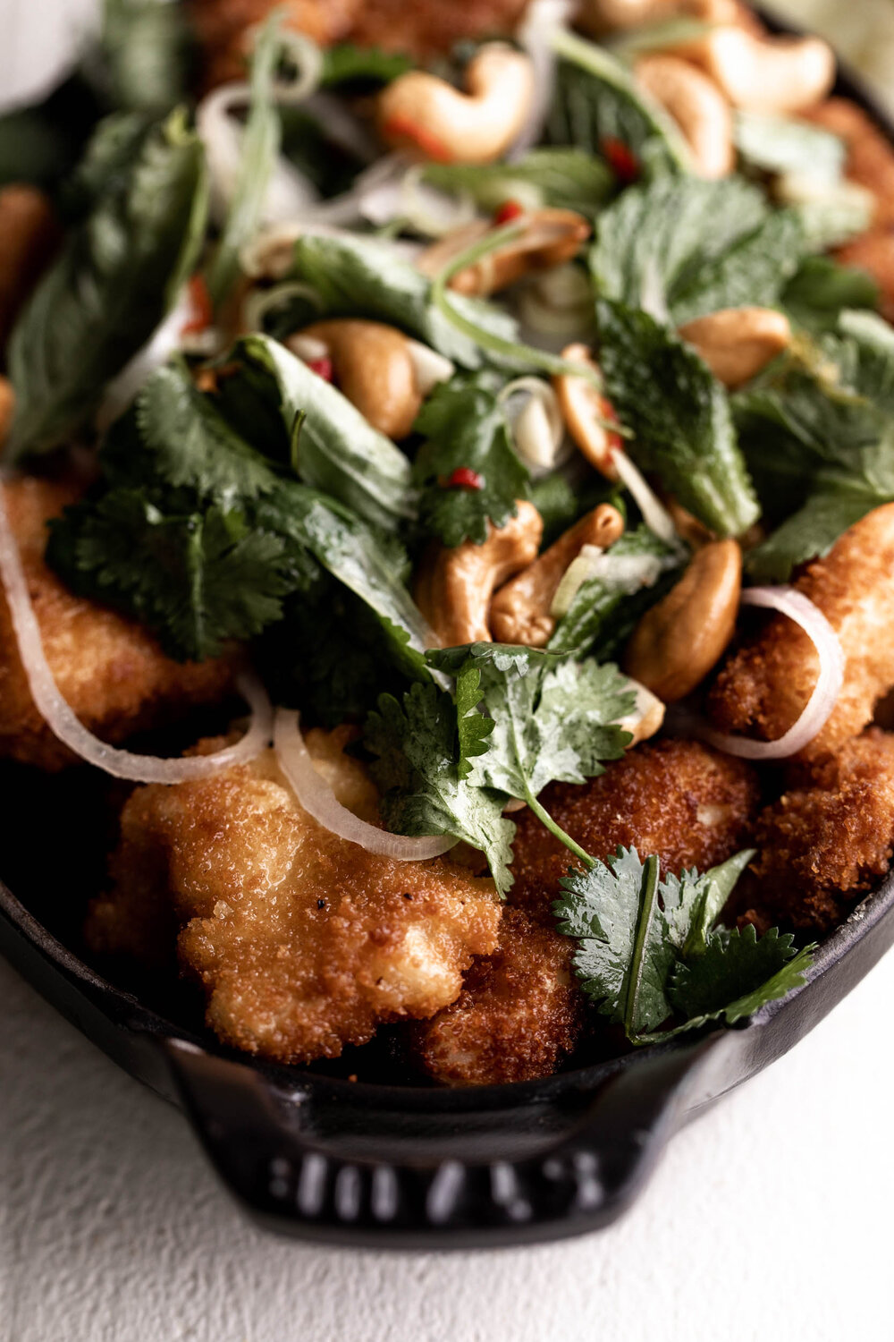 Thai Fried Red Snapper recipe with herb salad and cashews closeup