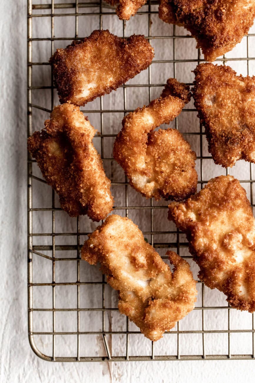 fried snapper on wire rack.
