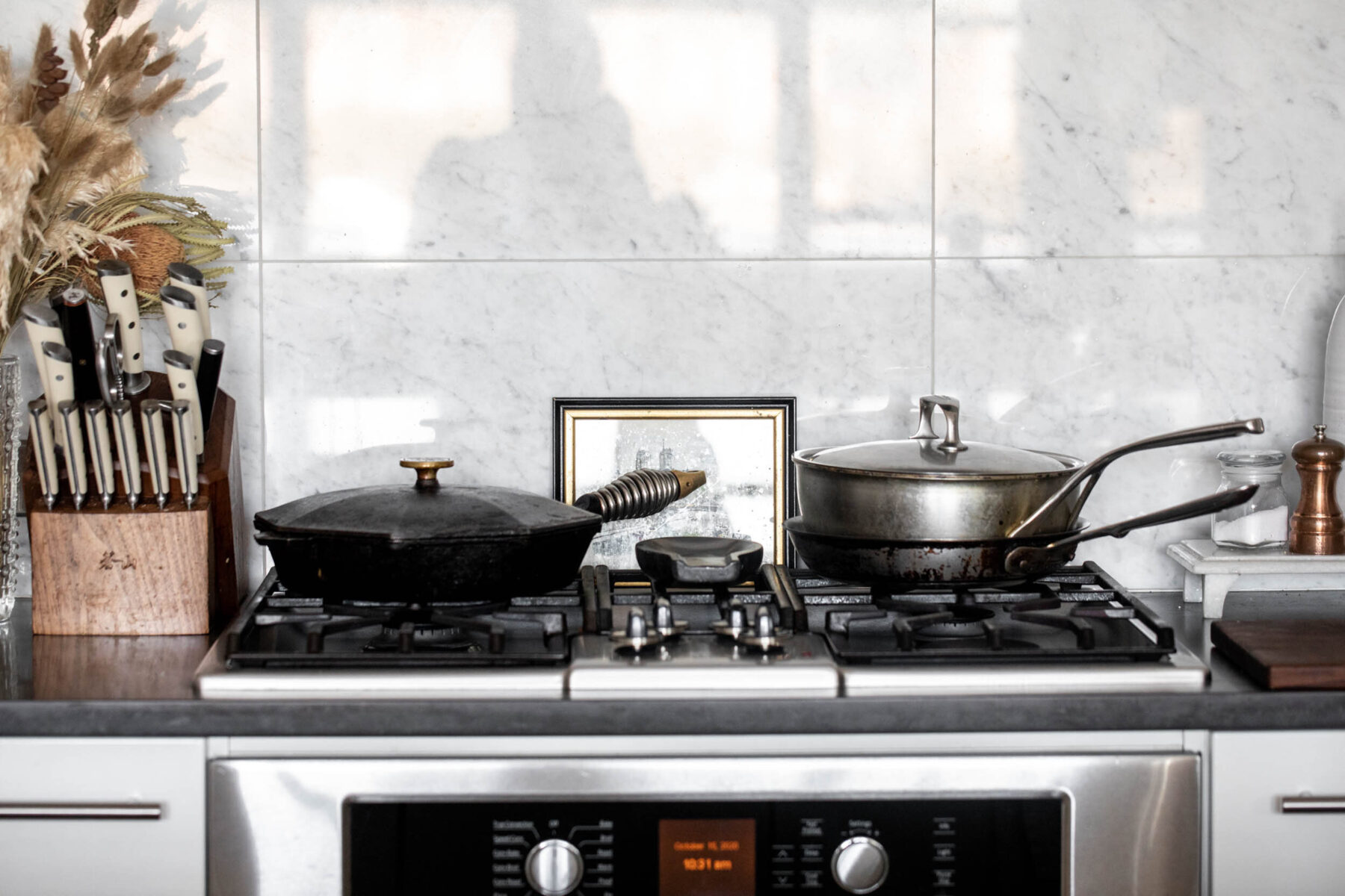Top 10 essential kitchen tools every cook should own pans on stove.