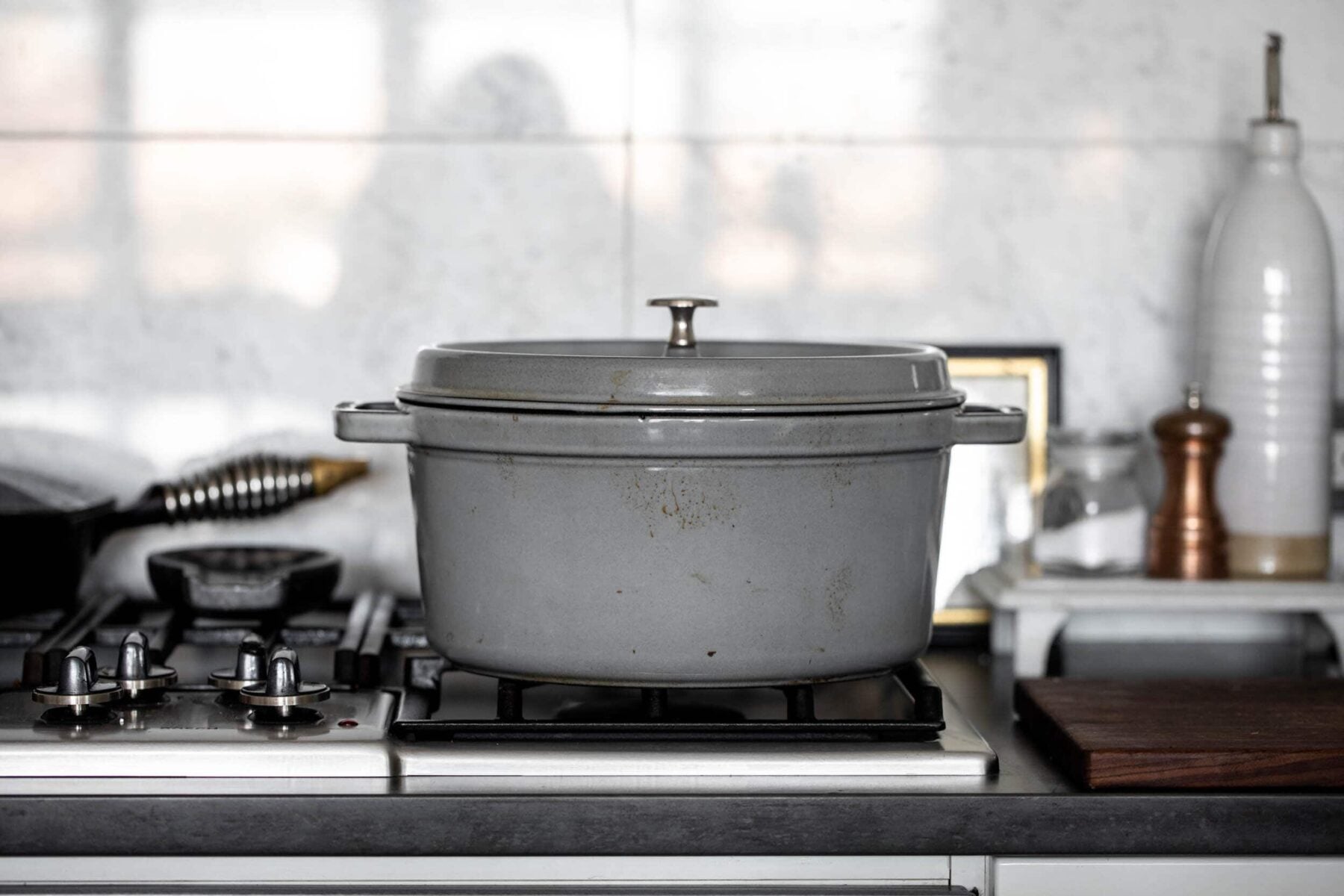 essential kitchen tools every cook should own dutch oven on stove.