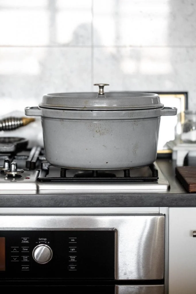 essential kitchen tools every cook should own dutch oven on stove.