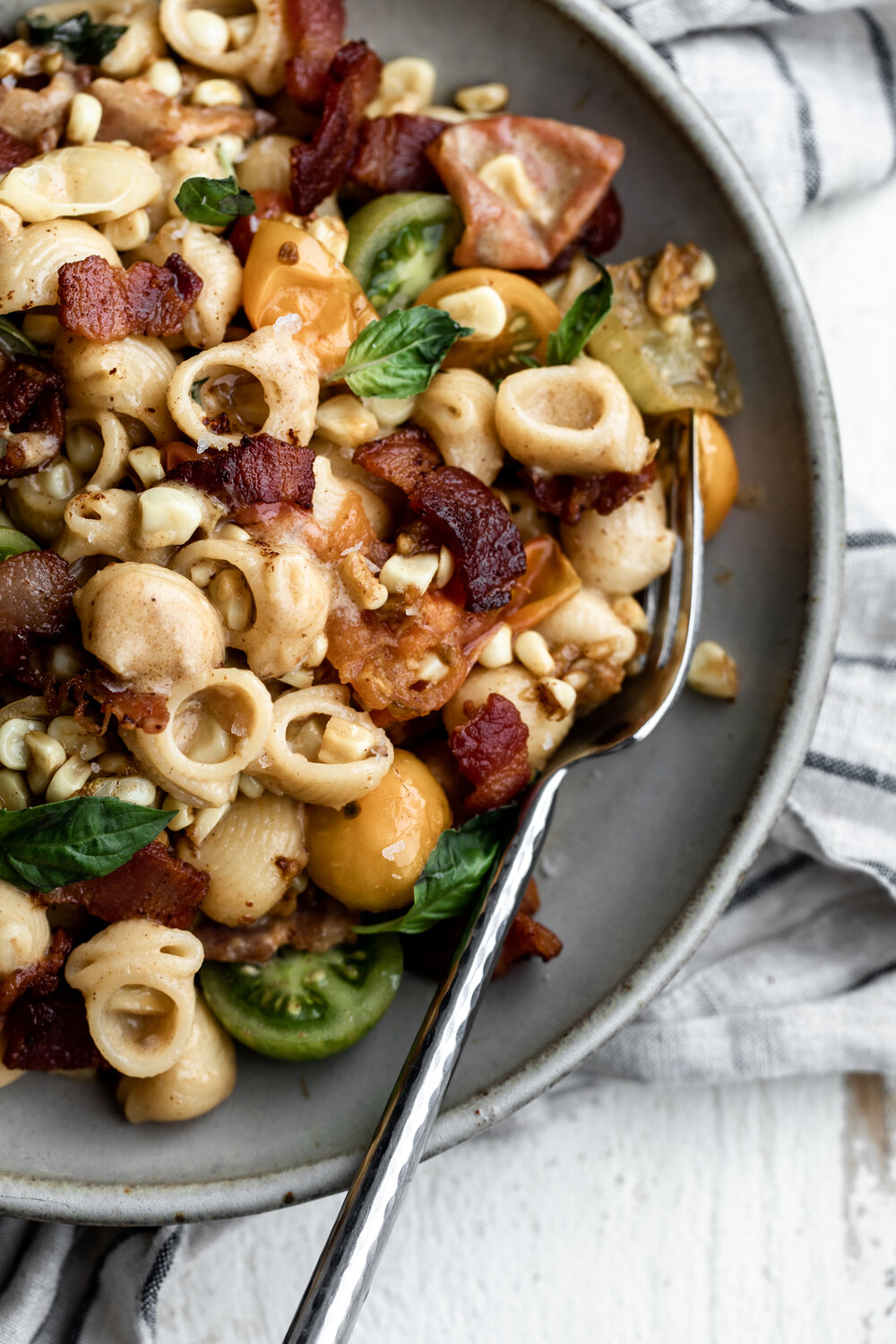 Tomato Corn Pasta with Bacon Cream Sauce and basil