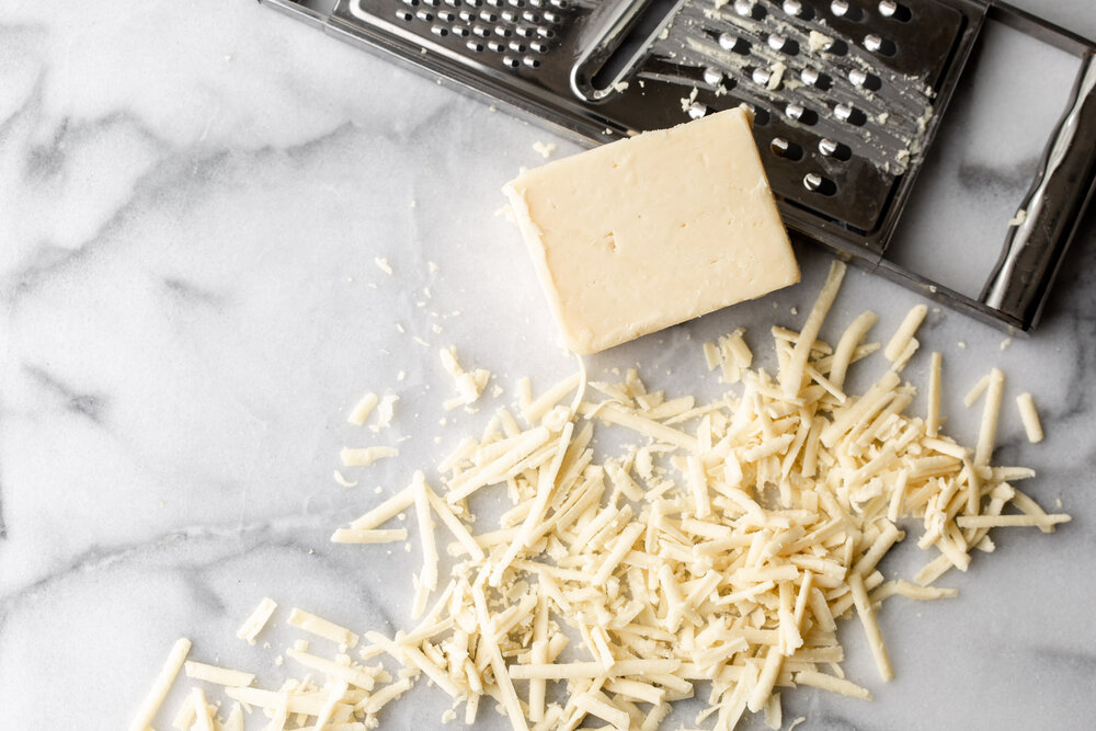 Grated white cheddar cheese