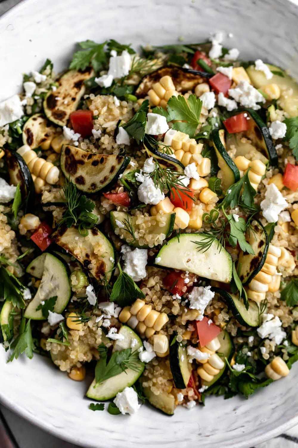 summer quinoa salad recipe with honey lemon vinaigrette with zucchini, corn, tomatoes in this vegetarian dish