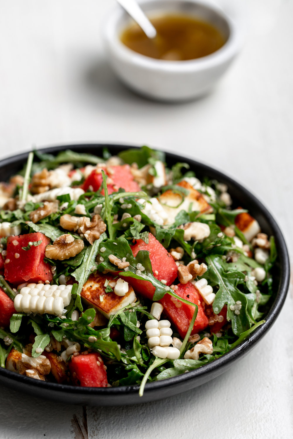 Watermelon with grains and grilled halloumi cheese