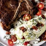Wedge salad with buttermilk herb dressing, halved cherry tomatoes and crumbled bacon paired with a steak.
