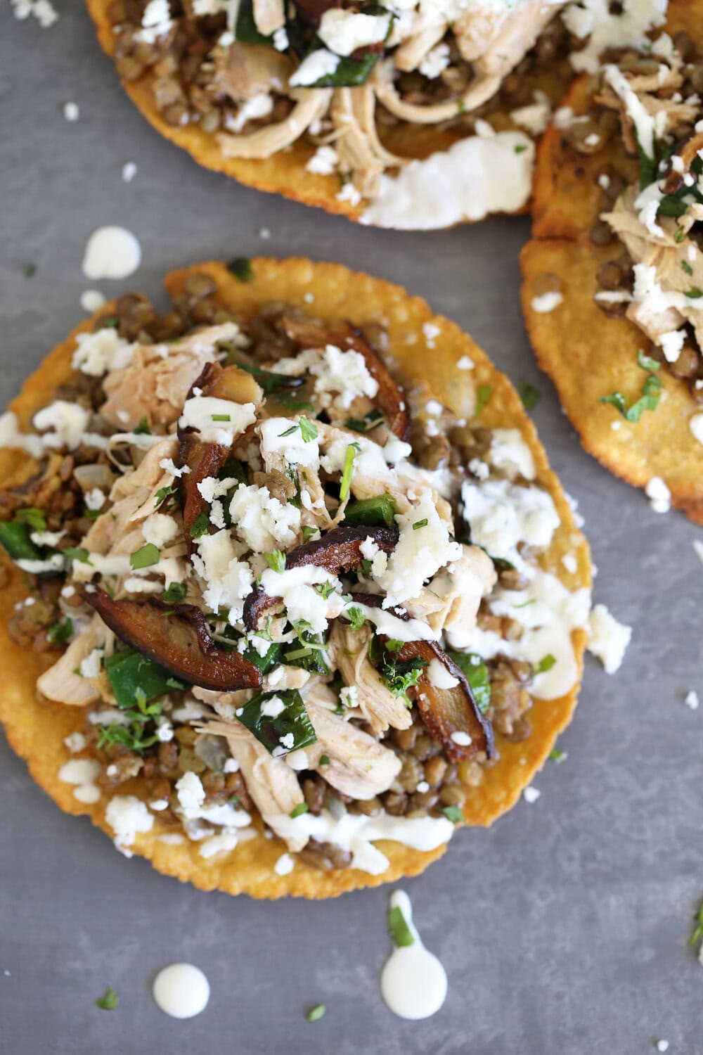Cilantro Lime Braised Chicken Tostada with Refried Lentils.