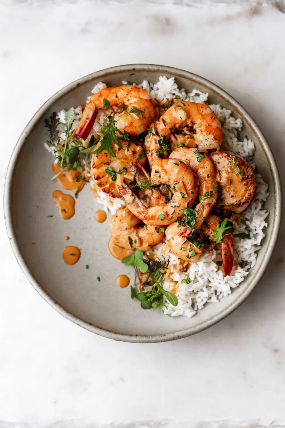 Creamy Seafood Sauce Over Shrimp & Scallops with rice in bowl