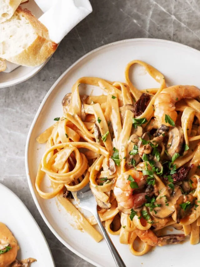This sun dried tomato cream sauce comes together with just a few ingredients and is served with sautéed mushrooms and shrimp over fettuccine for an easy Mediterranean-inspired pasta dinner. The recipe is based off a dish at Tony’s Taverna in Malibu.