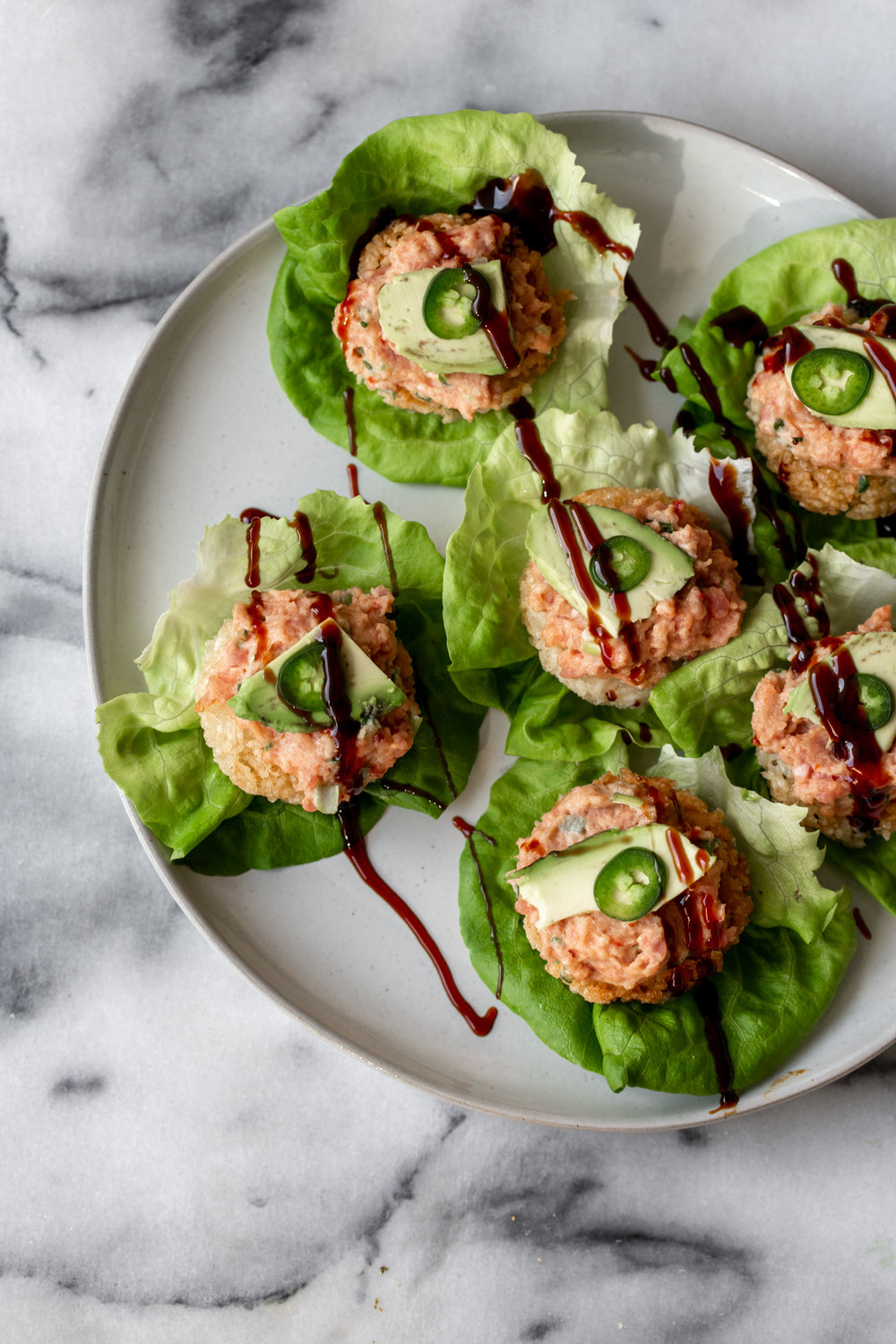 crispy rice with spicy tuna and butter lettuce cooking with cocktail rings