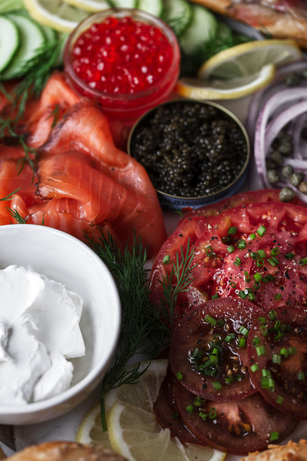 smoked salmon lox, caviar, salmon roe and marinated tomatoes with cream cheese