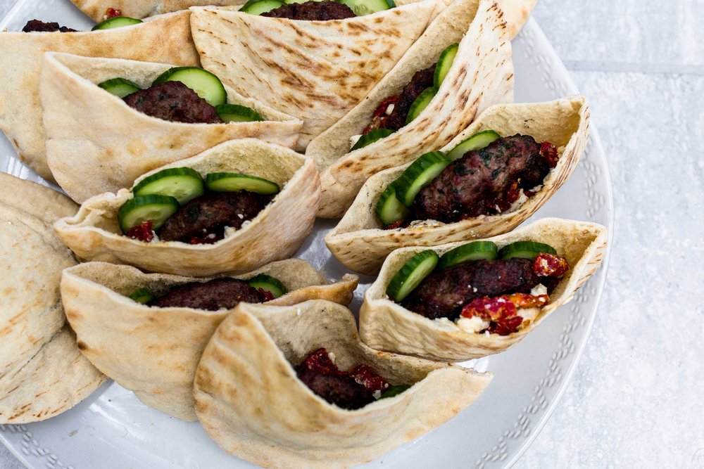 lamb burgers in pita cooking with cocktail rings american lamb