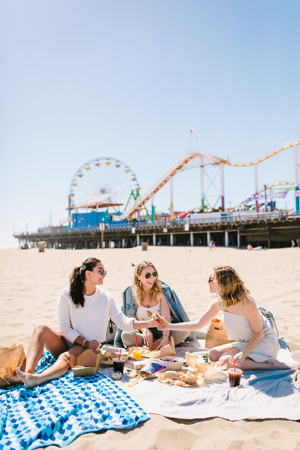 three women enjoying the best day in Westside of Los Angeles at the beach