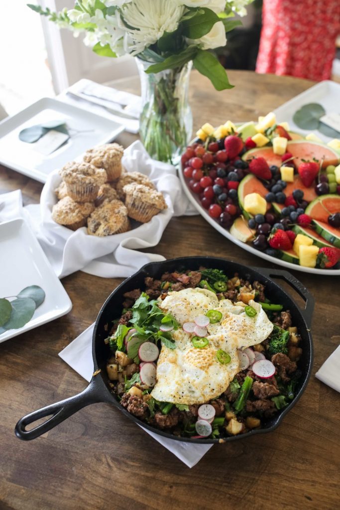 lamb merguez hash with muffins and fruit salad