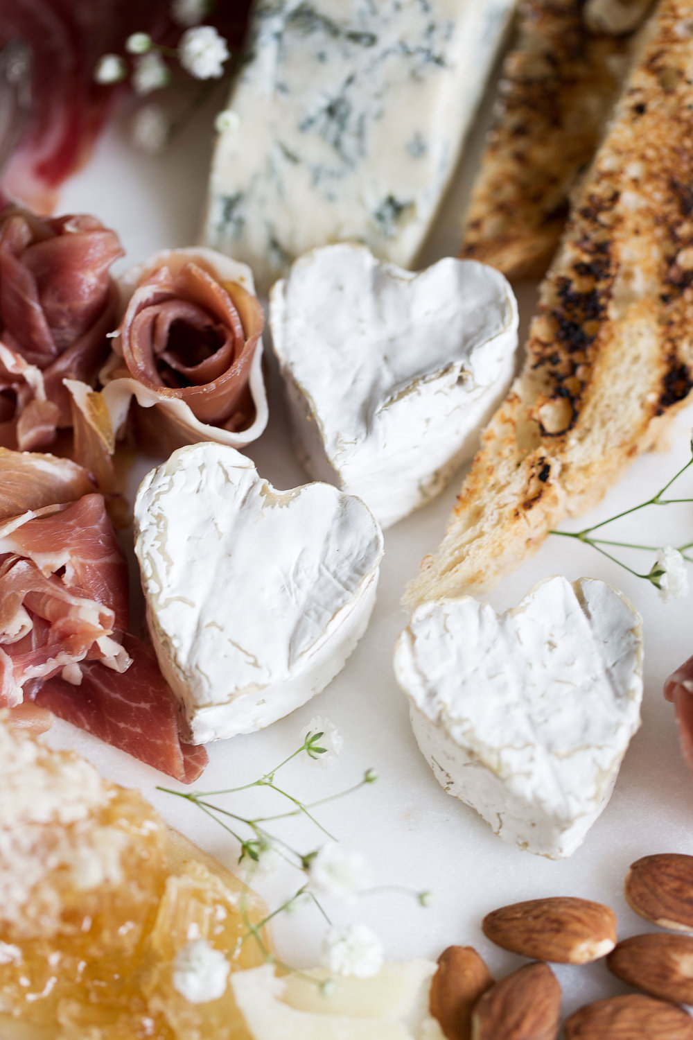 heart shaped brie on Valentine's Day cheeseboard