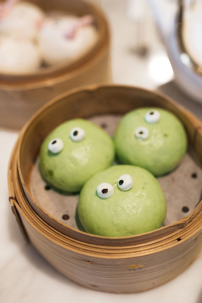 green steamed buns with eyes