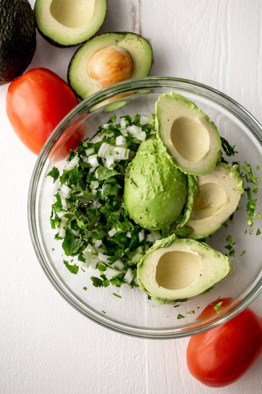 mashed avocados in mixing bowl.