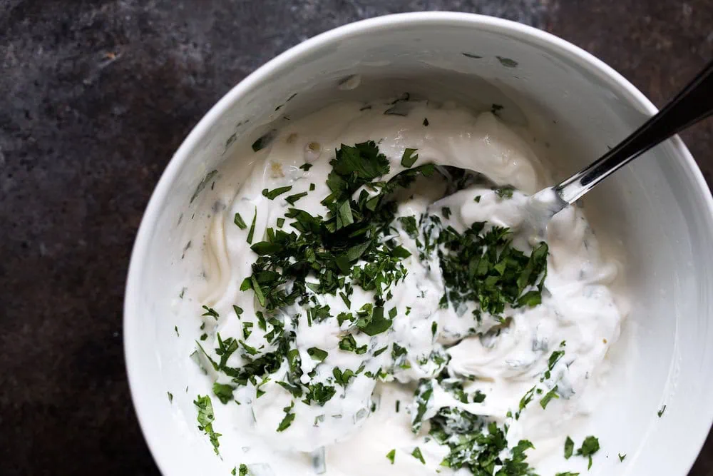 cilantro lime white sauce in small mixing bowl