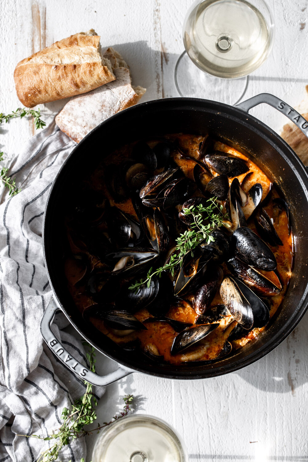 Steamed Mussels in Saffron Chorizo Broth topeed with thyme with bread