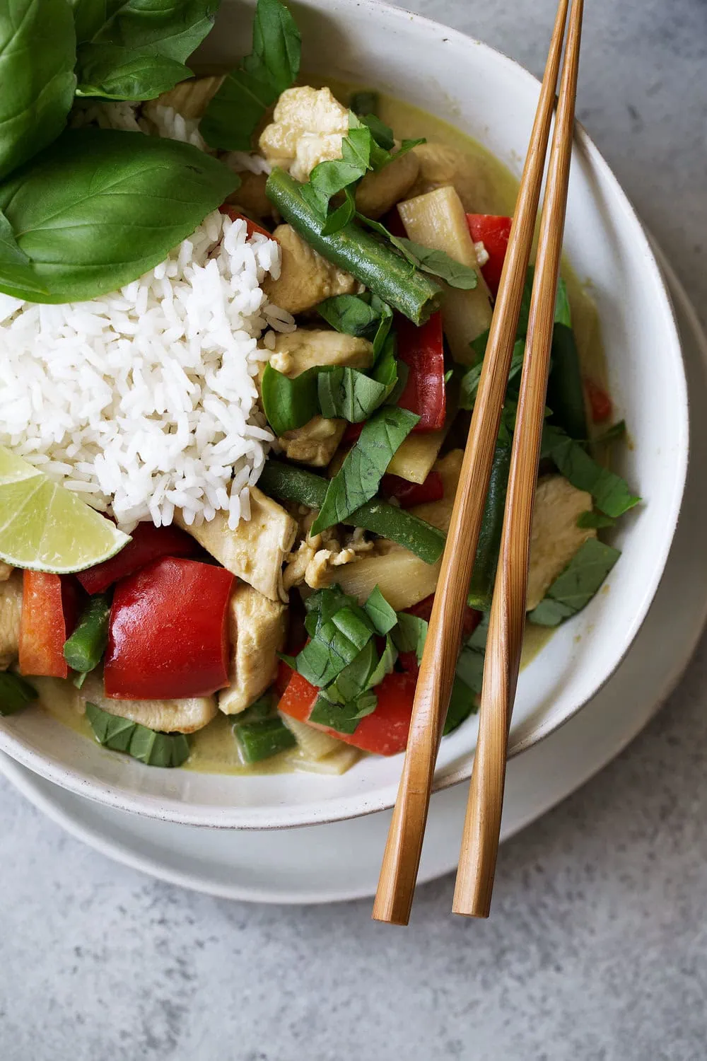 thai green curry chicken with bamboo shoots green beans and bell pepper over rice