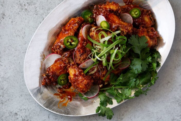 fried sweet chili wings with green onion, cilantro, radish and jalapeño.