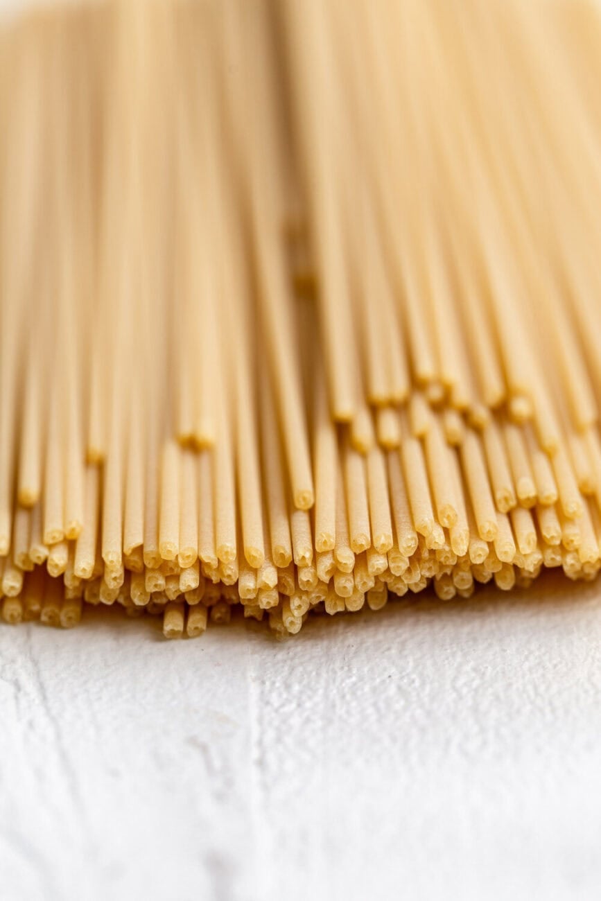 closeup of bucatini noodles with hole.