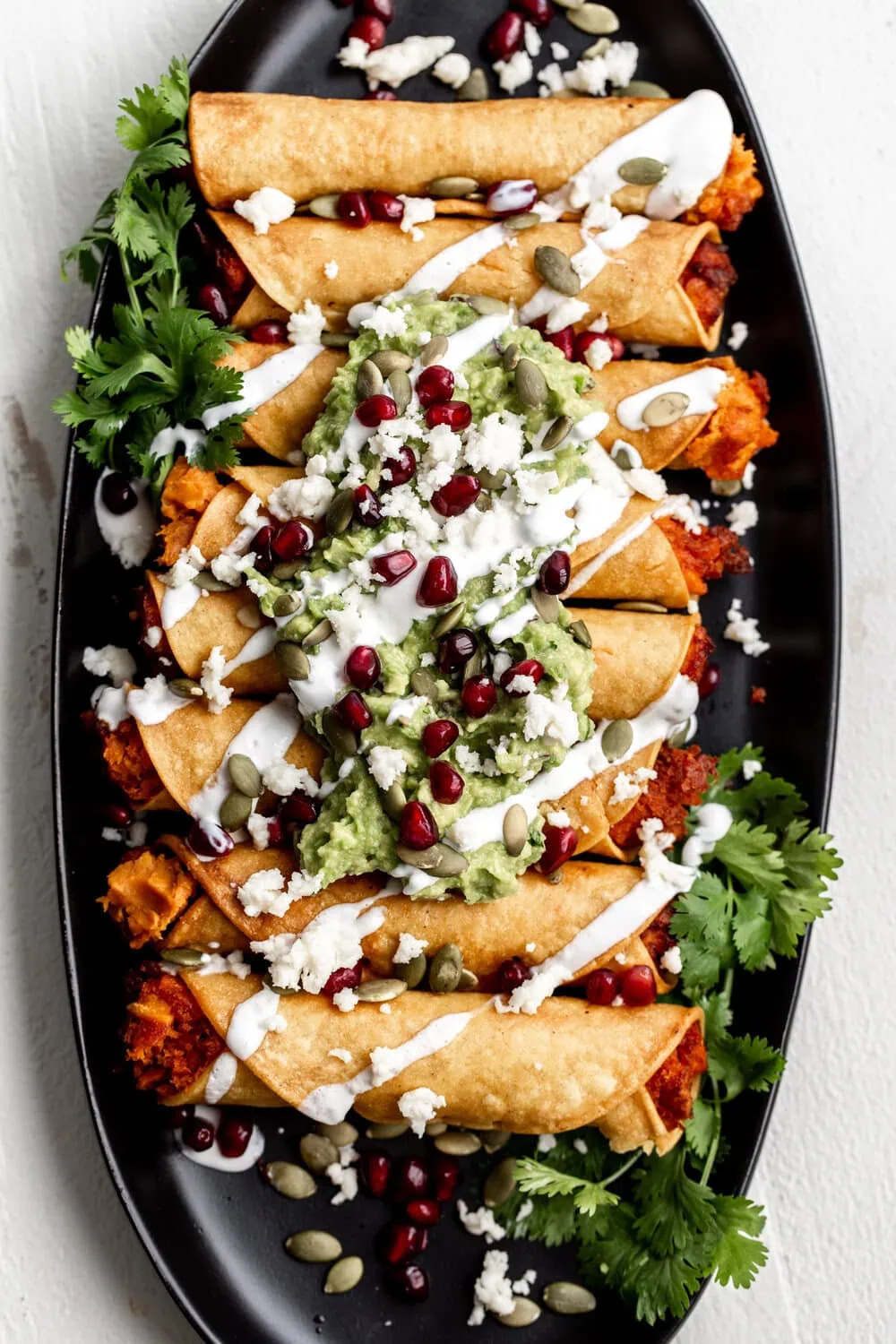 Sweet Potato Taquitos with Pomegranate & Pumpkin Seeds recipe