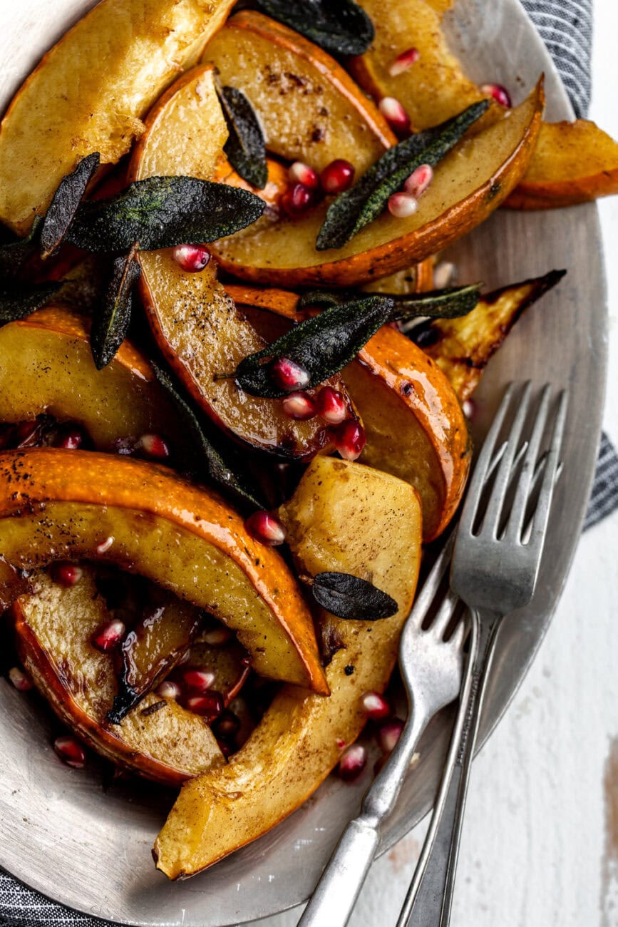 roasted acorn squash with crispy sage and pomegranate seeds.