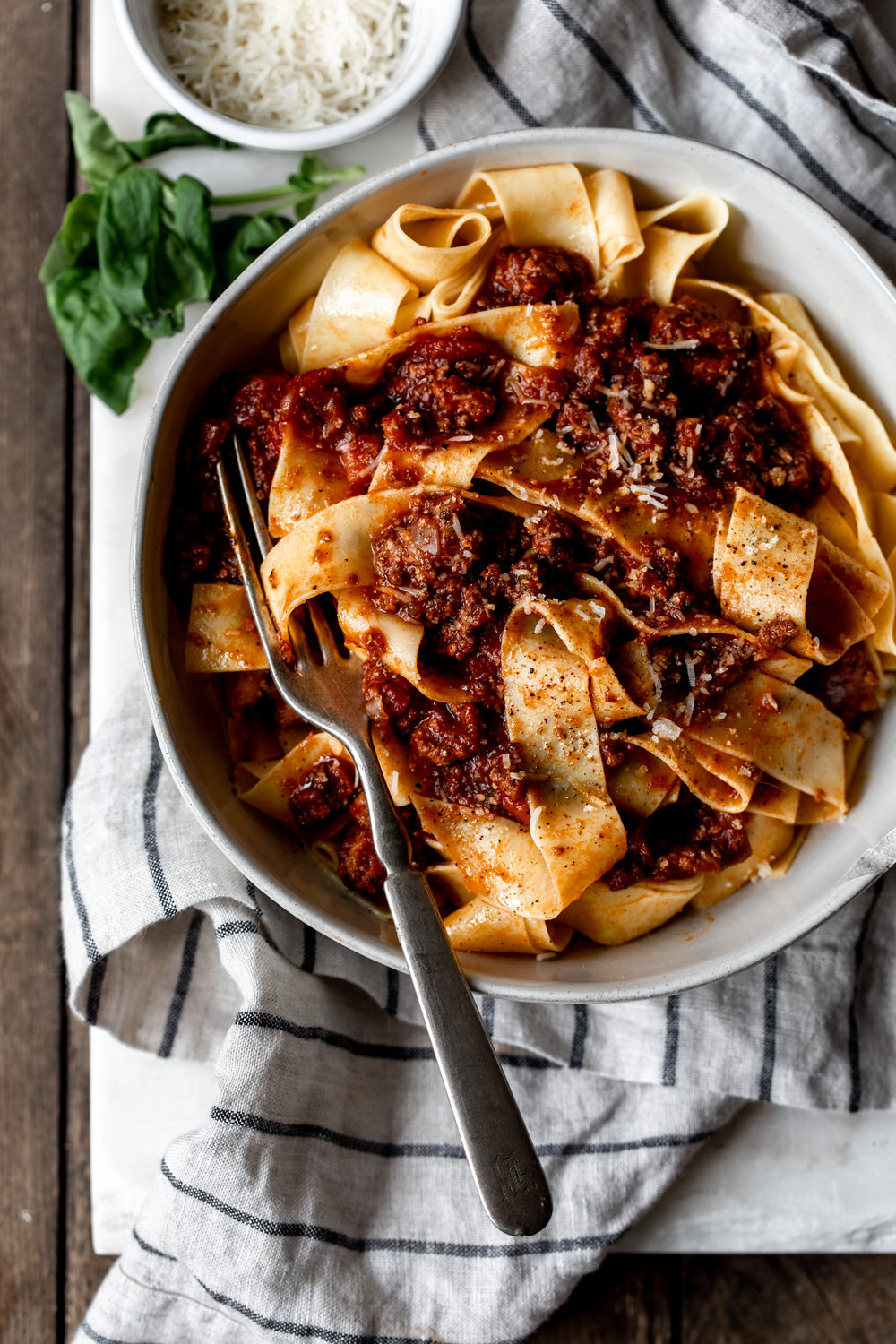 Bolognese sauce over Pappardelle recipe in pasta bowl with fork