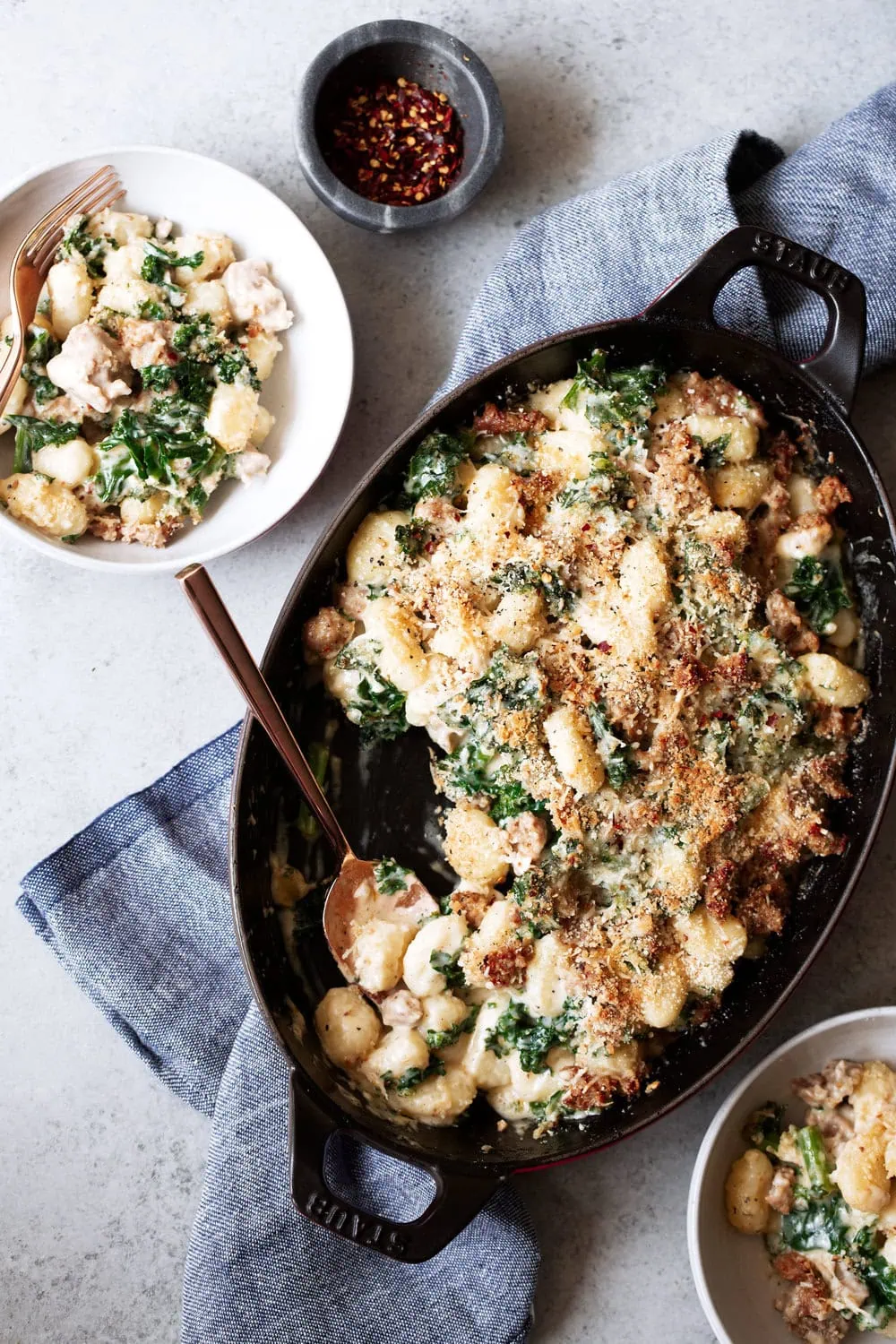 Garlic cream sauce, Italian sausage and tender kale make this gnocchi bake a cross between a gratin and a fancy casserole.