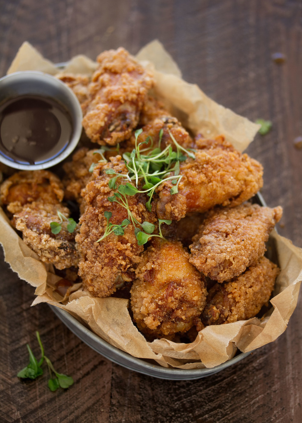 fried chicken and waffle wings with bourbon maple syrup