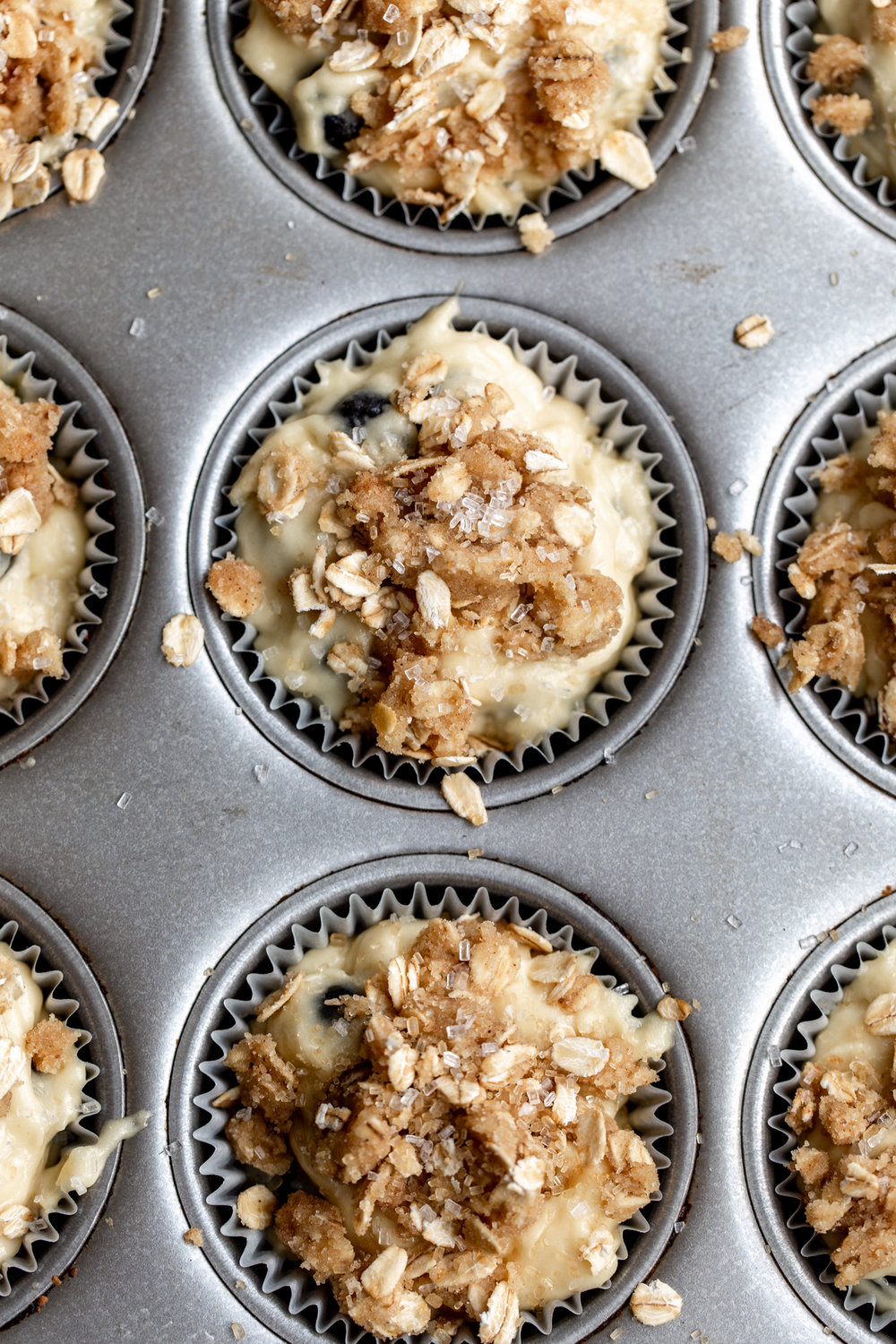 Blueberry Lemon Curd Muffins with Streusel in muffin tin