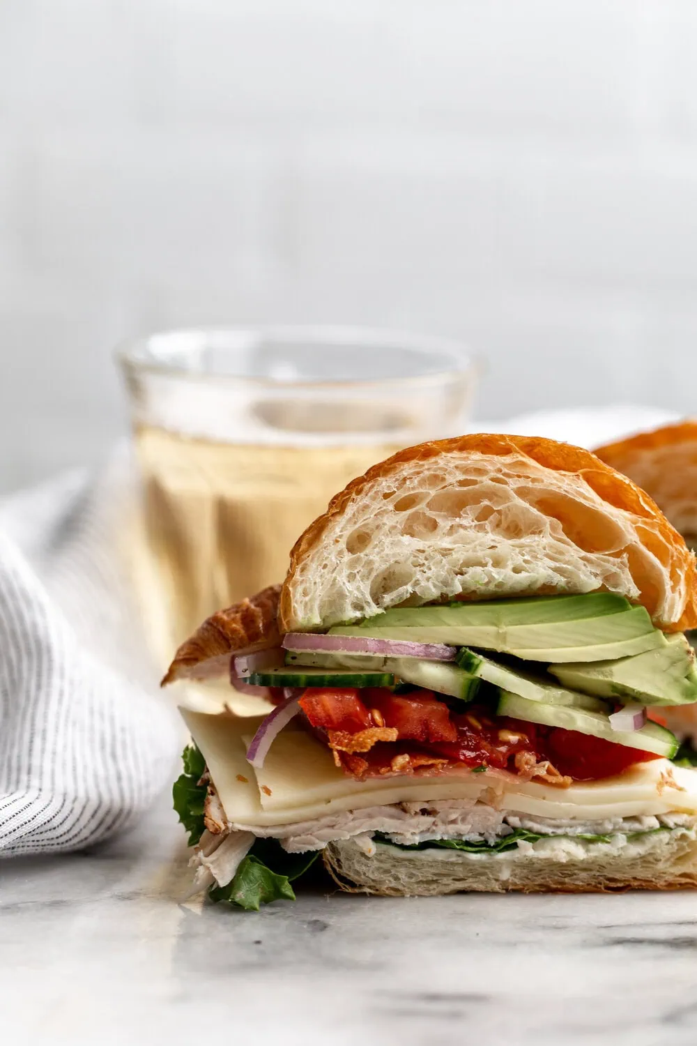 Croissant Club Sandwich with Crispy Prosciutto cut open